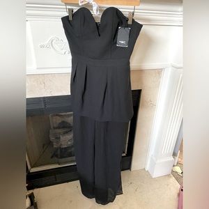 Black strapless jumpsuit with sheer legs